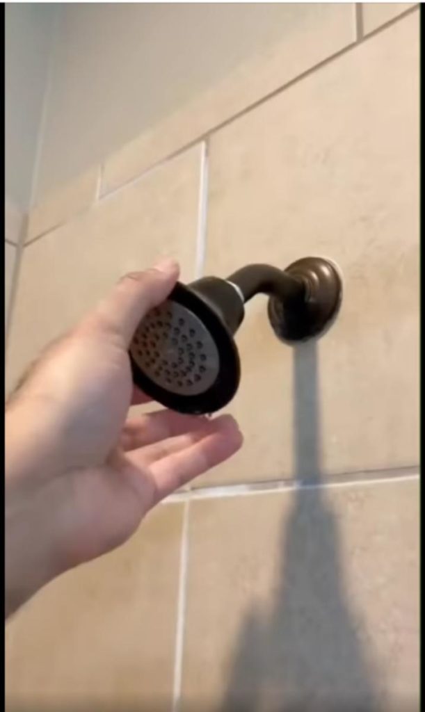 why your shower head is stuck